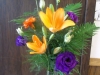Vase arrangment of orange lilies, purple lizzy, mini carnations